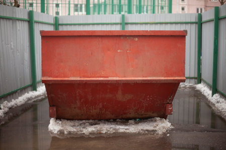 Garbage container. Steel waste tank in the city. Large garbage can in yard. Details of urban infrastructure.の写真素材