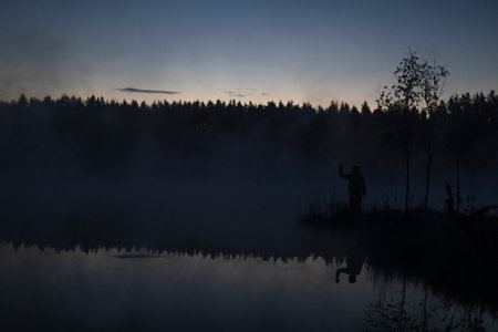 lake in early morning. lake and forest in fog. Details of nature in summer. beautiful scenery.の写真素材