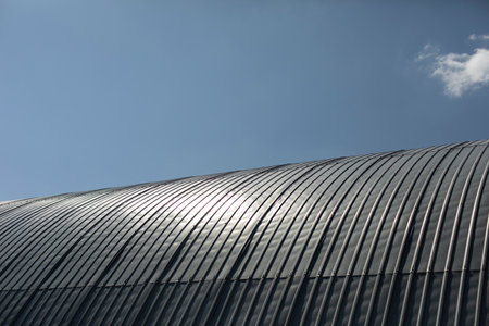 Steel roof. Dome construction. Warehouse made of metal profile. Roof slope.の写真素材