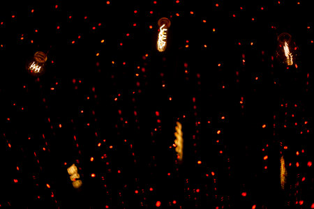 red garland. Lights in dark. Window decoration details. light on glass.の写真素材