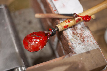 Sealing wax is prepared before use. Special substance for sealing letters. Sealing wax is poured into a spoon and heated.の写真素材