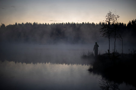 lake in early morning. lake and forest in fog. Details of nature in summer. beautiful scenery.の写真素材