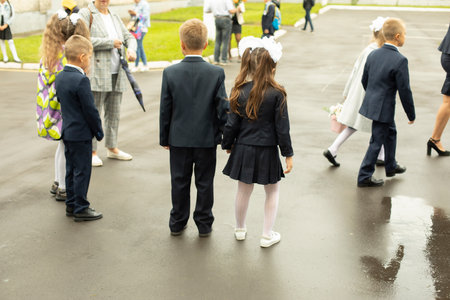 Schoolboy on the street. First graders in school yard. children on playground.の写真素材