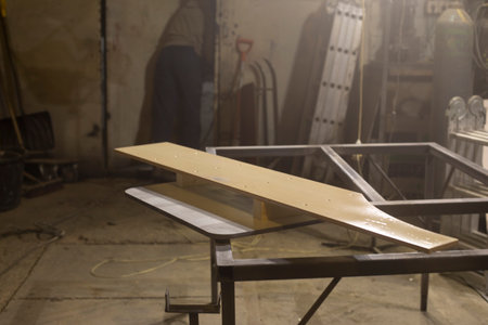board on table. woodworking workshop. Details of furniture manufacturing. raw board.の写真素材
