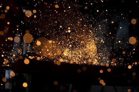 Sparks of metal. steel sawing. industrial background. Lots of bright sparks on dark background.の写真素材