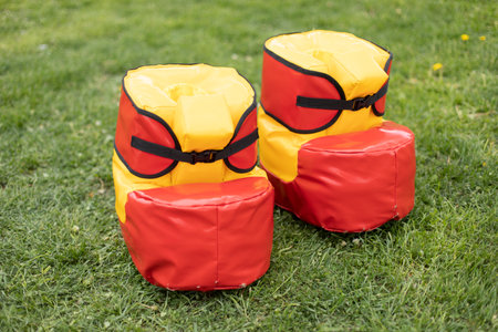 Cheerful red shoes. Equipment for playing outdoors. It's ridiculous run. Soft boots.の写真素材