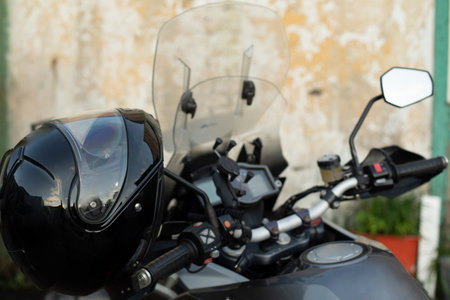Motorcycle handlebars. transport details. Helmet and handlebar of motorcycle. rear-view mirror.の写真素材