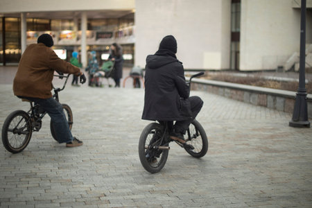 Guys on bikes. bmx bike. extreme sports in the city. Teenagers ride.