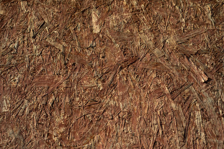 Texture of board. Background of wood. Pressed slivers. Rough surface.の写真素材