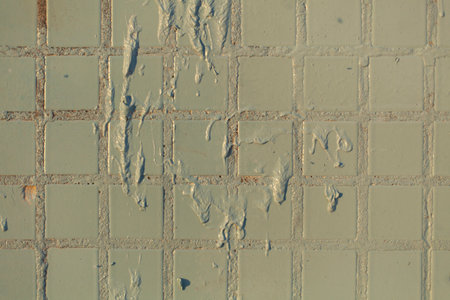 Blue tiles on wall in paint. Painted tiles of building. Details of building. Texture of wall.の写真素材