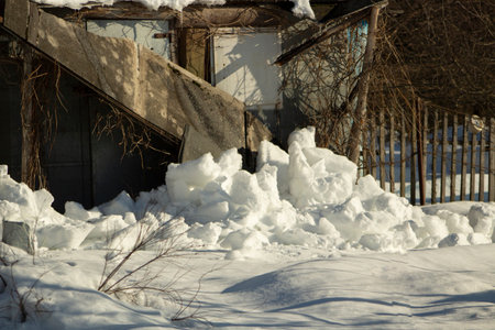 I'm on old barn. Snow fell from cabin. Snowy winter in Russia. old building.の写真素材