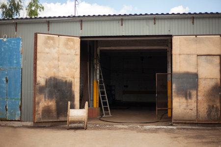 Garage door. Entrance to warehouse. Large gate to building. industrial zone. Entrance for large vehicles.の写真素材