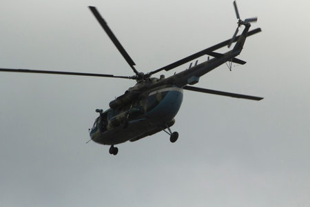Helicopter in sky. Air transport fly across the sky. flight details. propeller blades.の写真素材