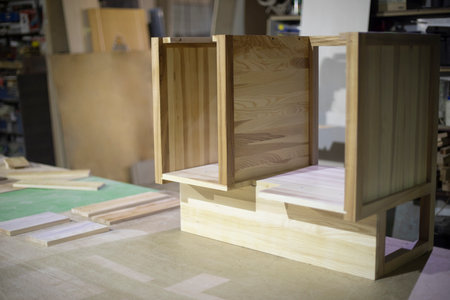 Creation of furniture in carpentry workshop. Table made of wood. polished board. Project of cabinet for things. Object is in workshop.の写真素材