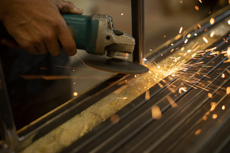metal sawing. Circular saw for cutting steel. Sparks from force of friction. Hand holding grinder.