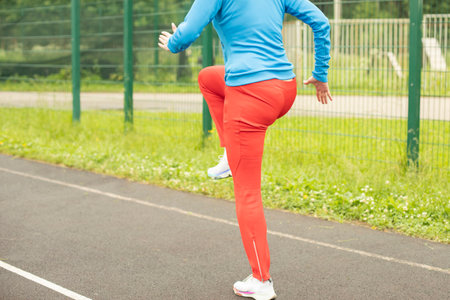 Playing sports on the street. outdoor training. Woman burn calories.の写真素材