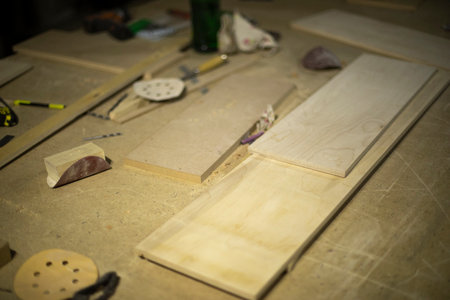 boards on table. Details of carpentry workshop. Process of creating furniture. things in garage. board processing.の写真素材