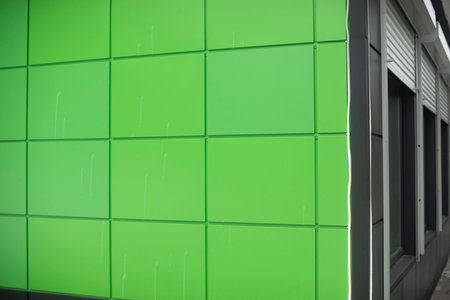 Green wall panels. Details of building. Bright color in hybrid architecture. green squares.の写真素材