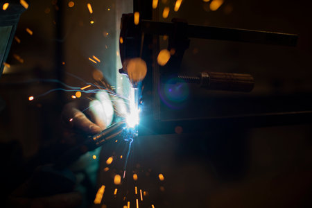 Welding work. high temperature. hot steel. metal welding. production details. Creation of welding seam.の写真素材