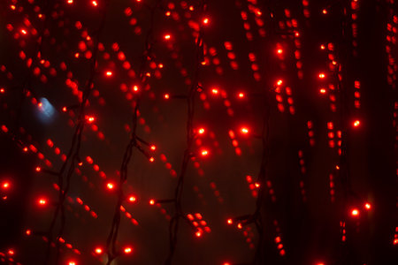Red lights in the dark. Lights on glass. indoor games. interior details. red.の写真素材