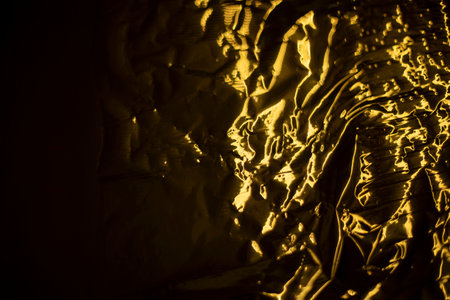 texture gold. background golden waves. Broken film. Gift wrapping details.の写真素材