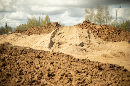 excavated soil. excavated earth. construction details. Creating embankment for road. Many building materials.の写真素材