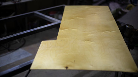 Board is thin. Details of carpentry workshop. Tree is on table. Carved figure from board. cabinet cover.の写真素材