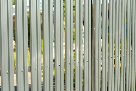 steel fence. Fence around area. Gray steel profile. Details of country house.の写真素材