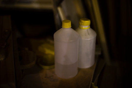 Canister of acetone. paint solvent. plastic canister. Things in workshop. Two components of varnish.の写真素材