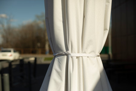 White umbrella on veranda. sun protection.の写真素材