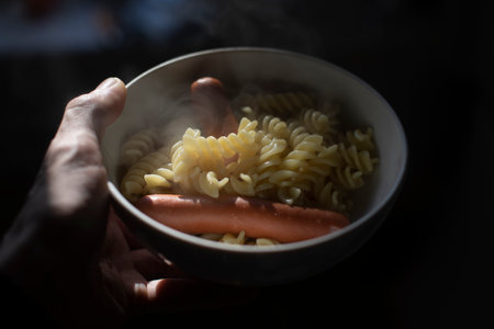 Pasta on plate. Sausages with pasta. Meals for lunch. Delicious sausages.の写真素材