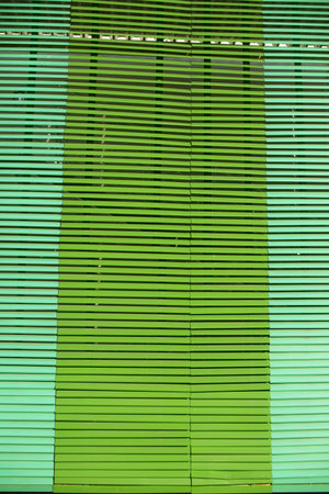 Large green blinds. Texture of blinds.Protection from light. Bright green tone.の写真素材