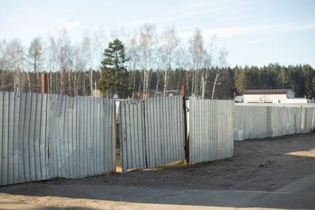 Steel fence around area. Stainless steel fence. Private territory. Rust on metal.の写真素材
