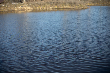 water on lake. Waves on water. Pond in city. Details of nature.の写真素材