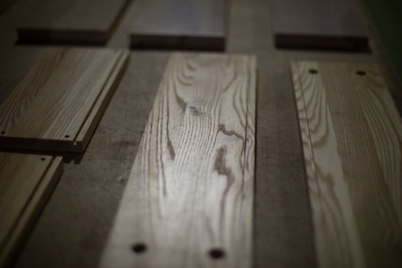 Board in carpentry workshop. Details of furniture manufacturing. wood processing. Detail of furniture.の写真素材