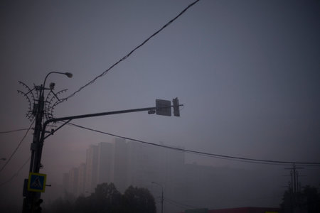 Fog on the road. Fog in the city. Early morning in the city. Haze over the city.の写真素材