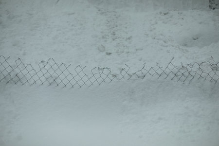 Blog in snow. Snow broke fence. Texture snow avalanche. Background after snowstorm.の写真素材