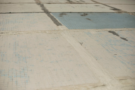 old wall of building. Small tile wall. Tiles in cladding of building. Cement seal in wall.の写真素材