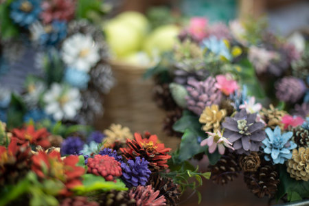 Composition of natural elements. Natural texture of beautiful flowers. Cones painted in different colors. A background of plants.の写真素材