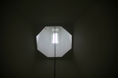 Window in temple. Light in window. Hole in roof. Interior details.の写真素材