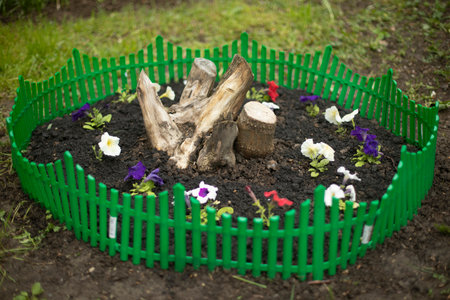 Garden with flowers. Flowerbed with plants. Garden Planting Details. Small flower bed.の写真素材