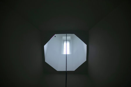 Window in temple. Light in window. Hole in roof. Interior details.の写真素材