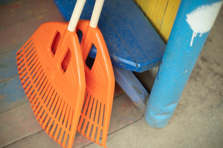 orange broom. cleaning tool. garden tool. Plastic bristles for collecting dry drains.の写真素材