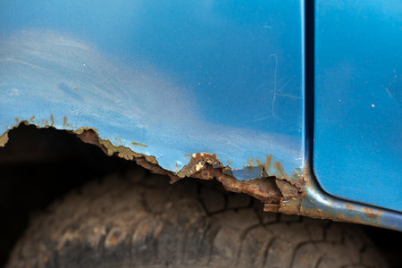 Rust on the car body. Rotted Metal. Damaged transport. Damaged Car Parts.の写真素材