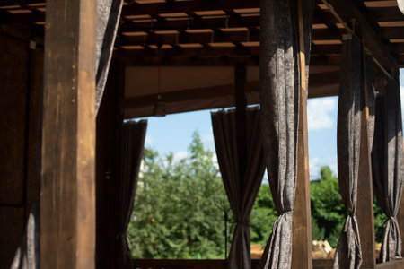 Curtains in restaurant. UPrivate Restaurant. Interior is made of wood. Details of architecture made of wood.の写真素材