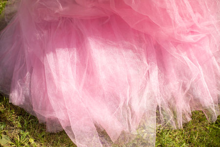 Pink dress. Light pink dress. Lightweight fabric. Summer clothes in park.の写真素材