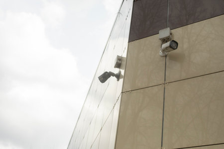 Video camera on wall. Territory surveillance system. Recorder.の写真素材