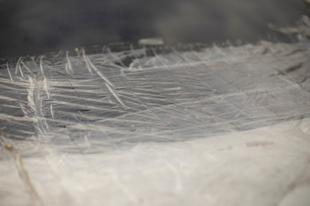 Adhesive tape on car. Sealed area on material. Sealed broken glass. repair details.の写真素材