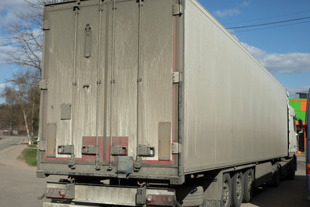Truck. Large body. Transportation of goods. Dirty truck body. White bodywork.の写真素材