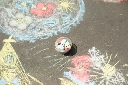 Crayons for drawing on asphalt. Children's drawing. Crayons of different colors. Children's drawings.の写真素材